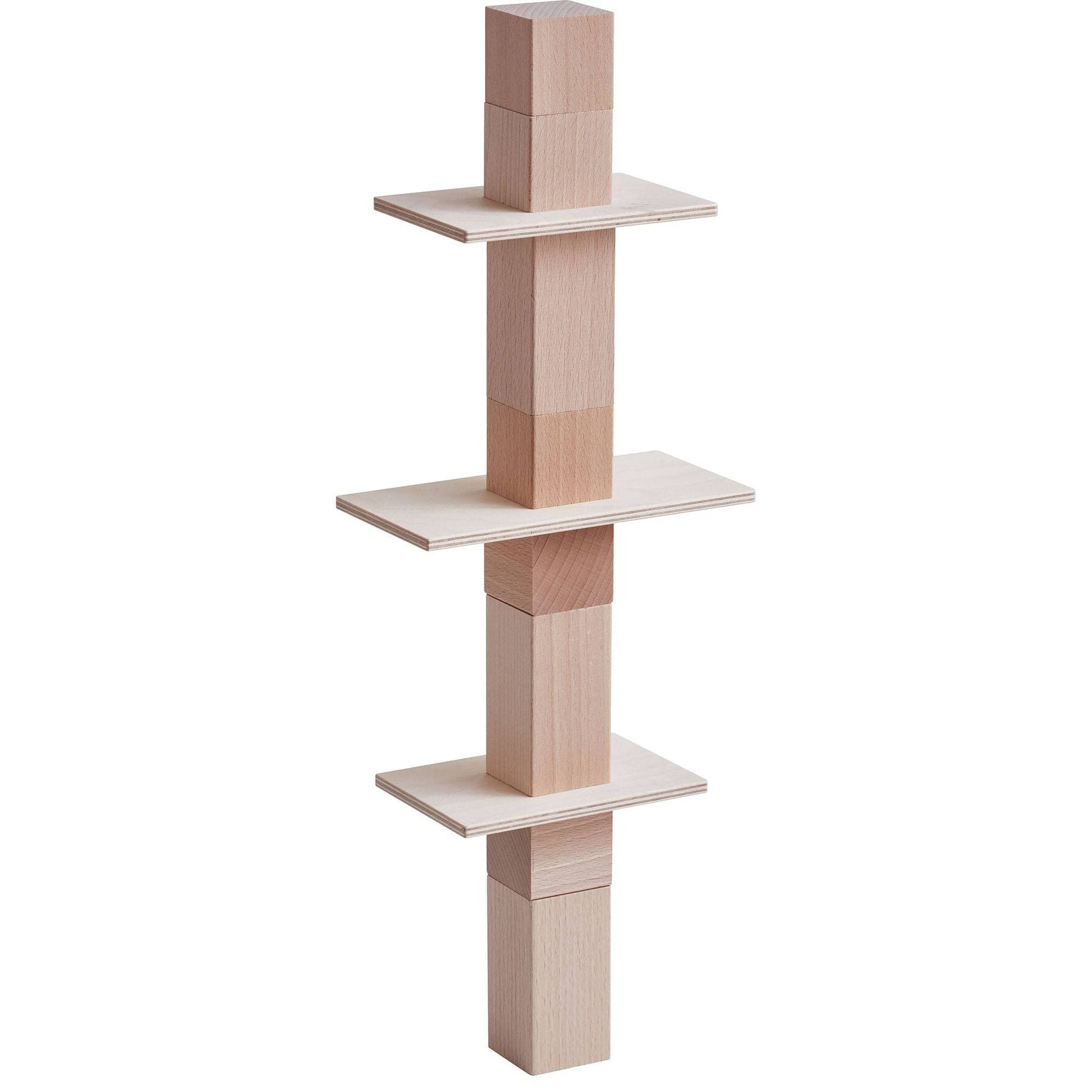 Tall vertical stack of wooden building blocks balanced with panels and cubes