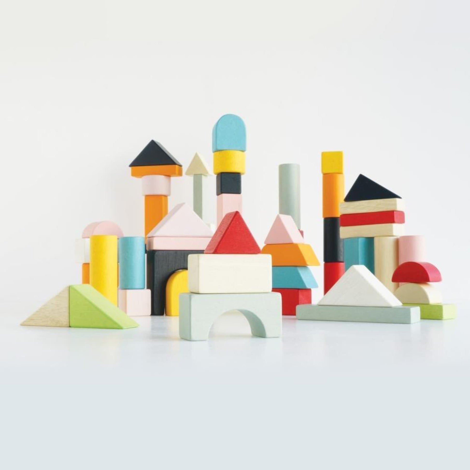 Colorful wooden building blocks on a white background