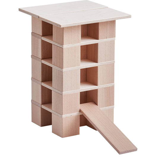 Wooden building blocks stacked into a tall tower with ramp using natural beechwood pieces