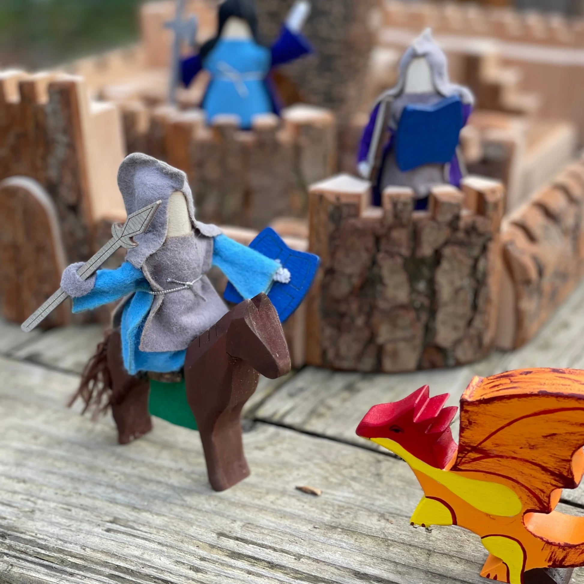 Wooden castle building set with knight and dragon for medieval small-world play