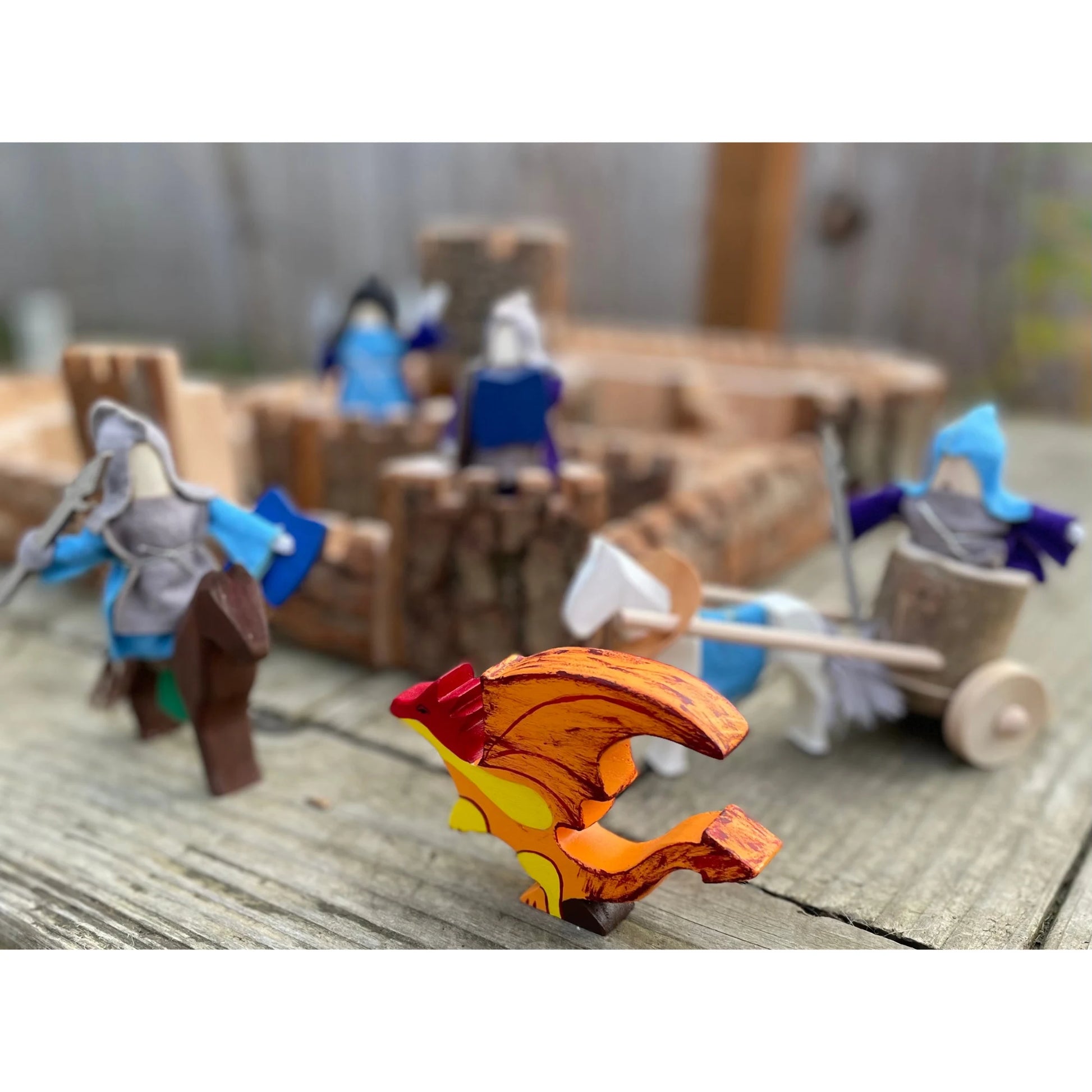 Natural wooden castle with knights and dragon during imaginative medieval play
