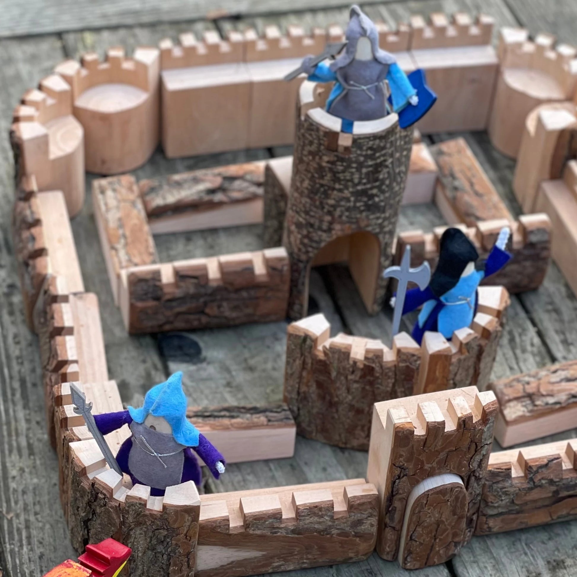 Wooden castle tower, gatehouse, and castle walls handcrafted from natural wood