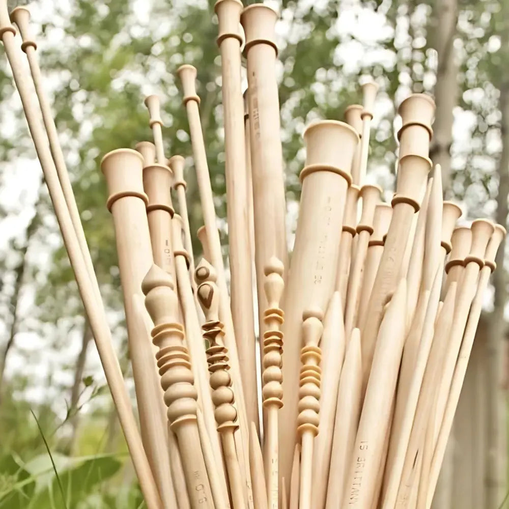 Bamboo straws with decorative patterns against a blurred natural background