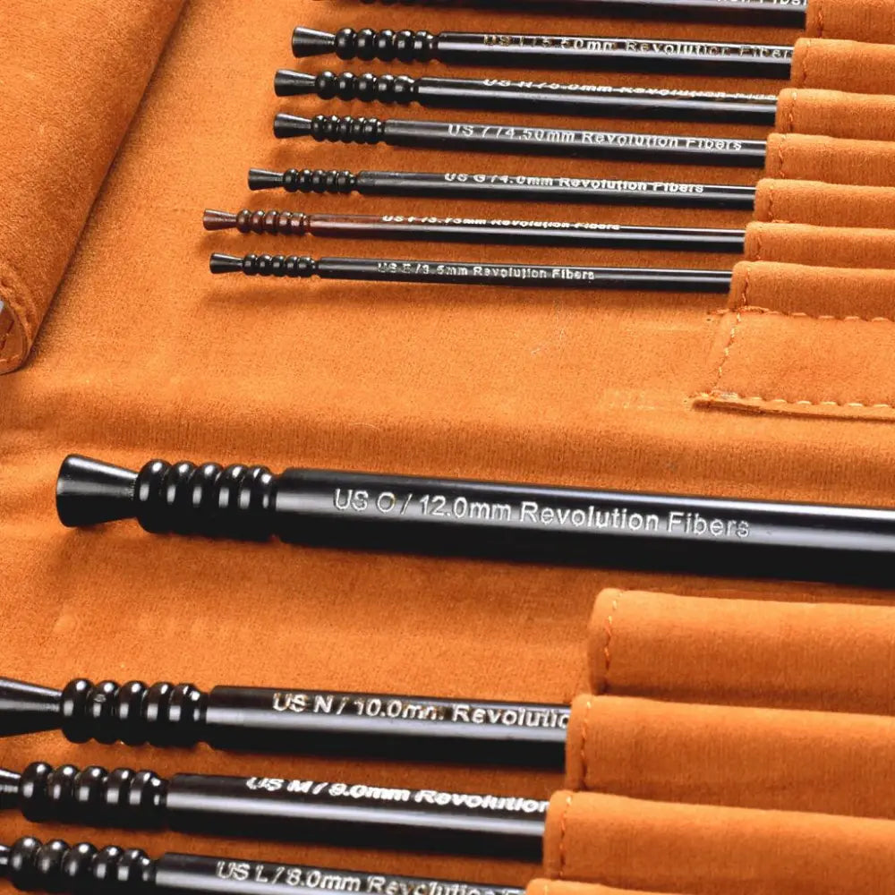 Set of black archery nocks on an orange background
