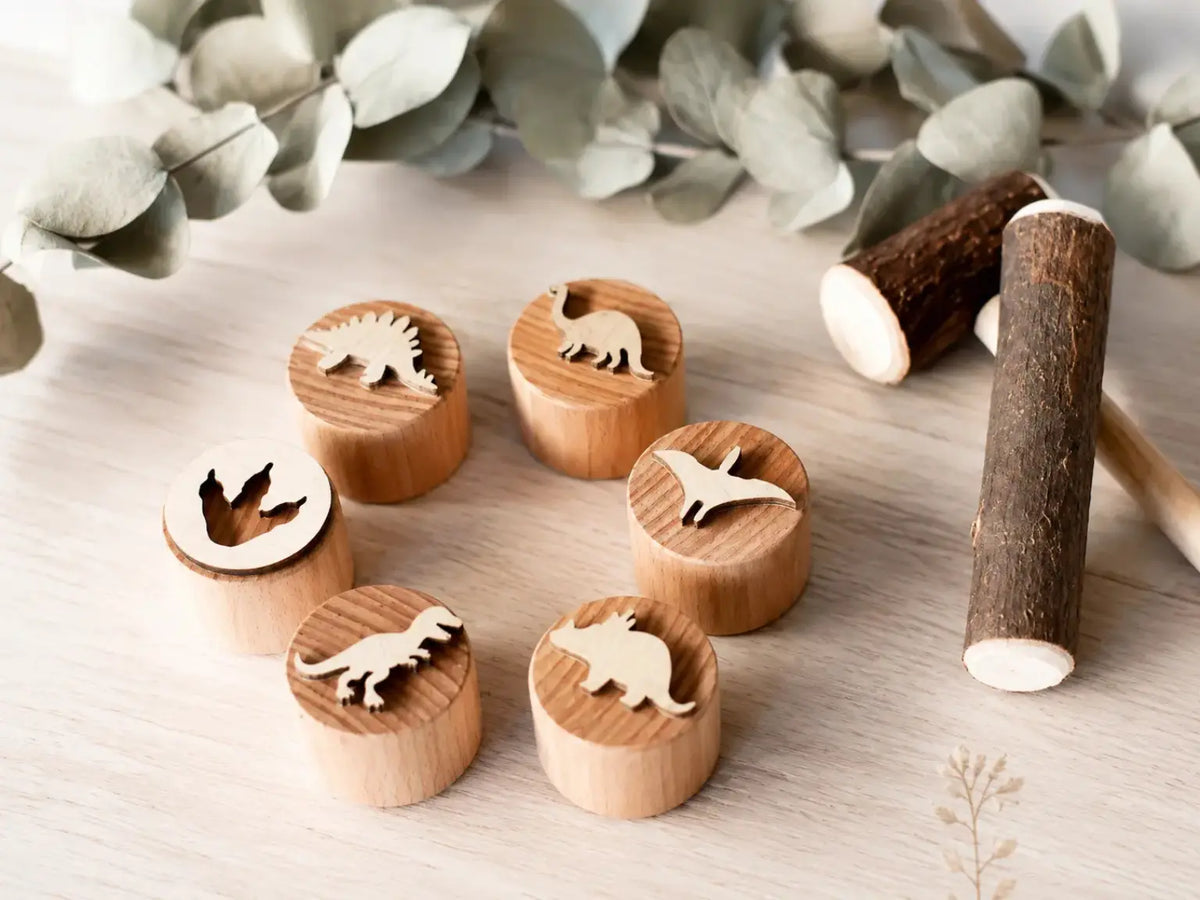 Wooden dinosaur play dough stamps with six designs and two natural wood rolling tools