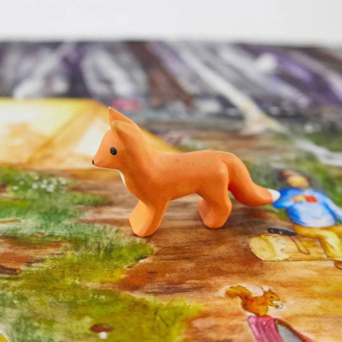 Sarah’s Silks wooden fox toy in a woodland small-world play scene