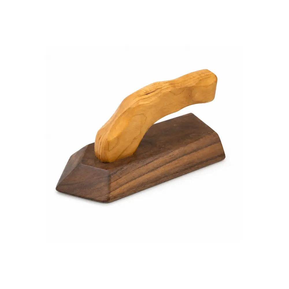 Side angle view of wooden toy iron with cherry handle and walnut base