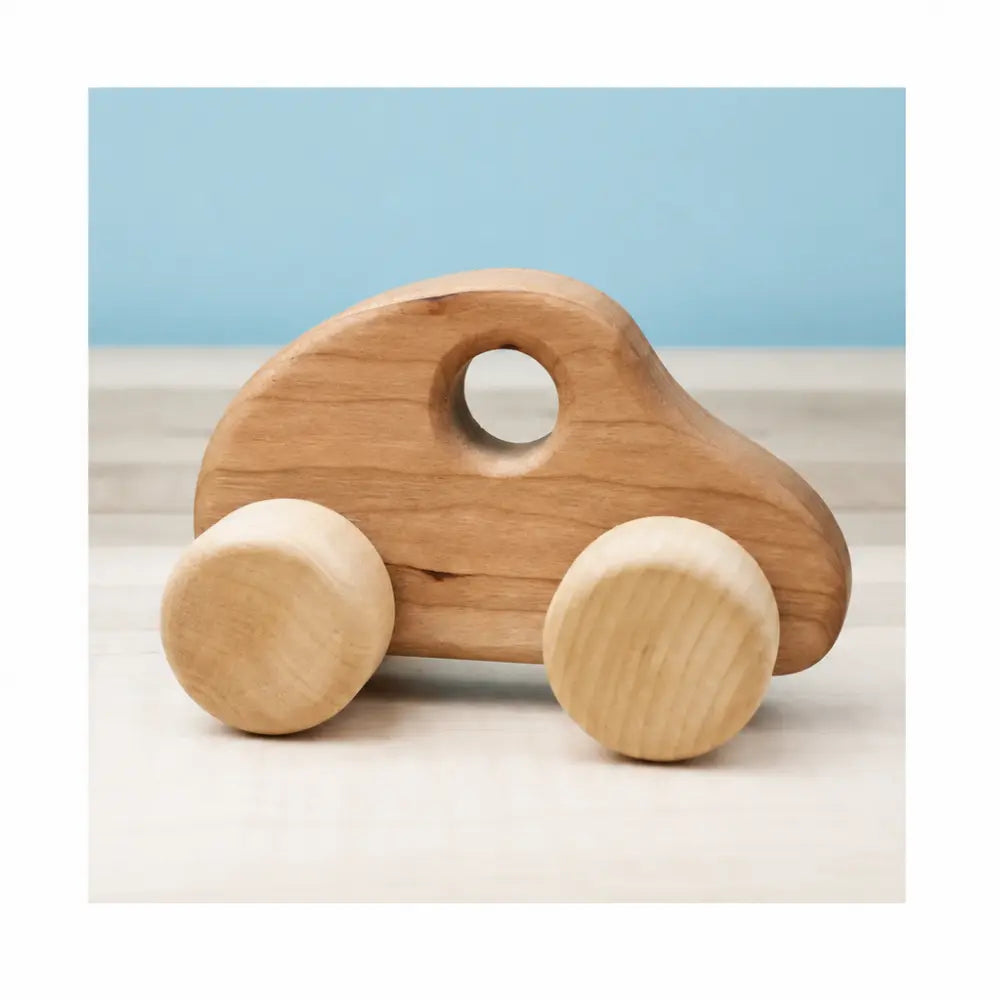 Wooden push car with cherry body and birch wheels