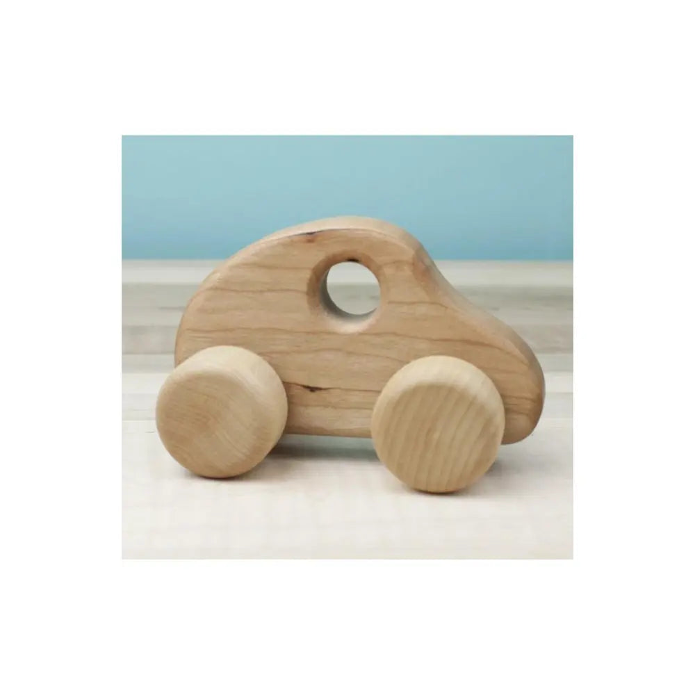 Handmade wooden push car with cherry body and birch wheels