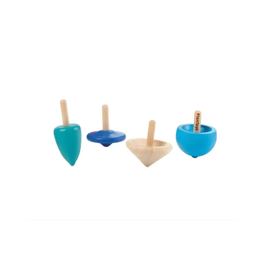 Set of four wooden spinning tops with different shapes and colors on a white background