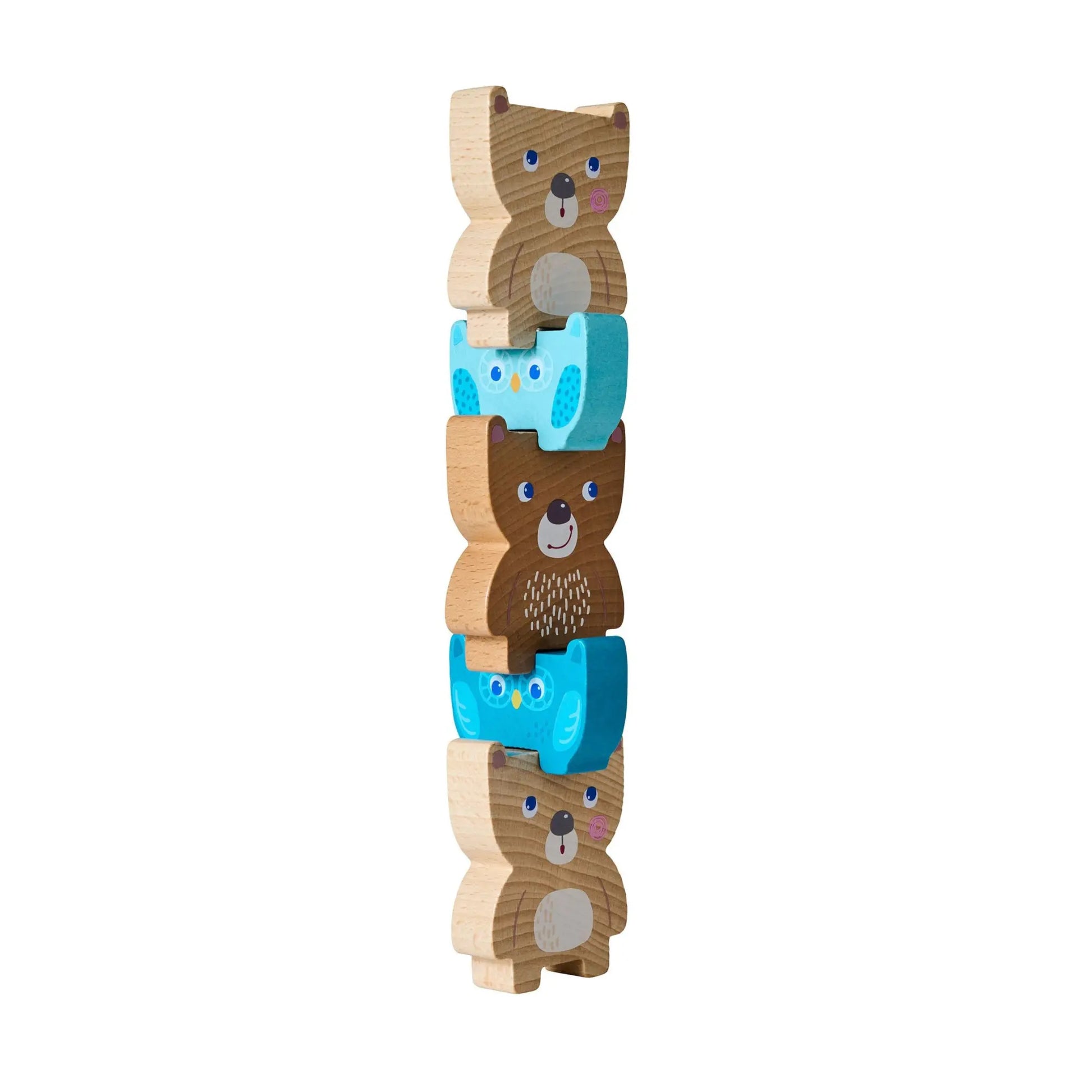 Stack of wooden bear toys with blue hats on a white background