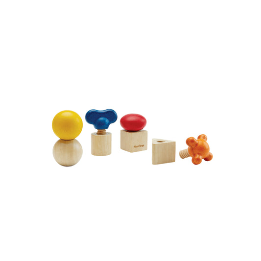 Set of colorful wooden toys nuts and bolts on a white background