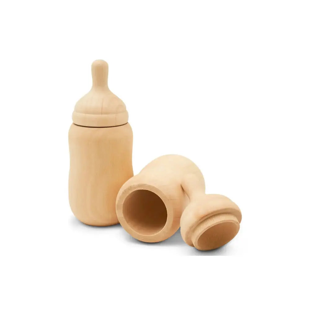 Wooden baby bottle and accessories on a white background