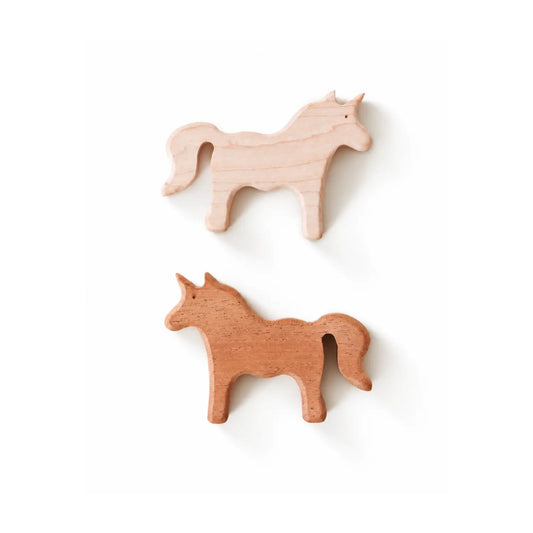 two wooden carved unicorn figures