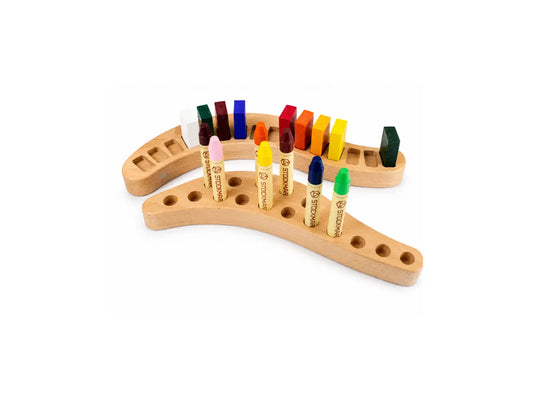 Wooden crayon holder with colorful crayons on a white background