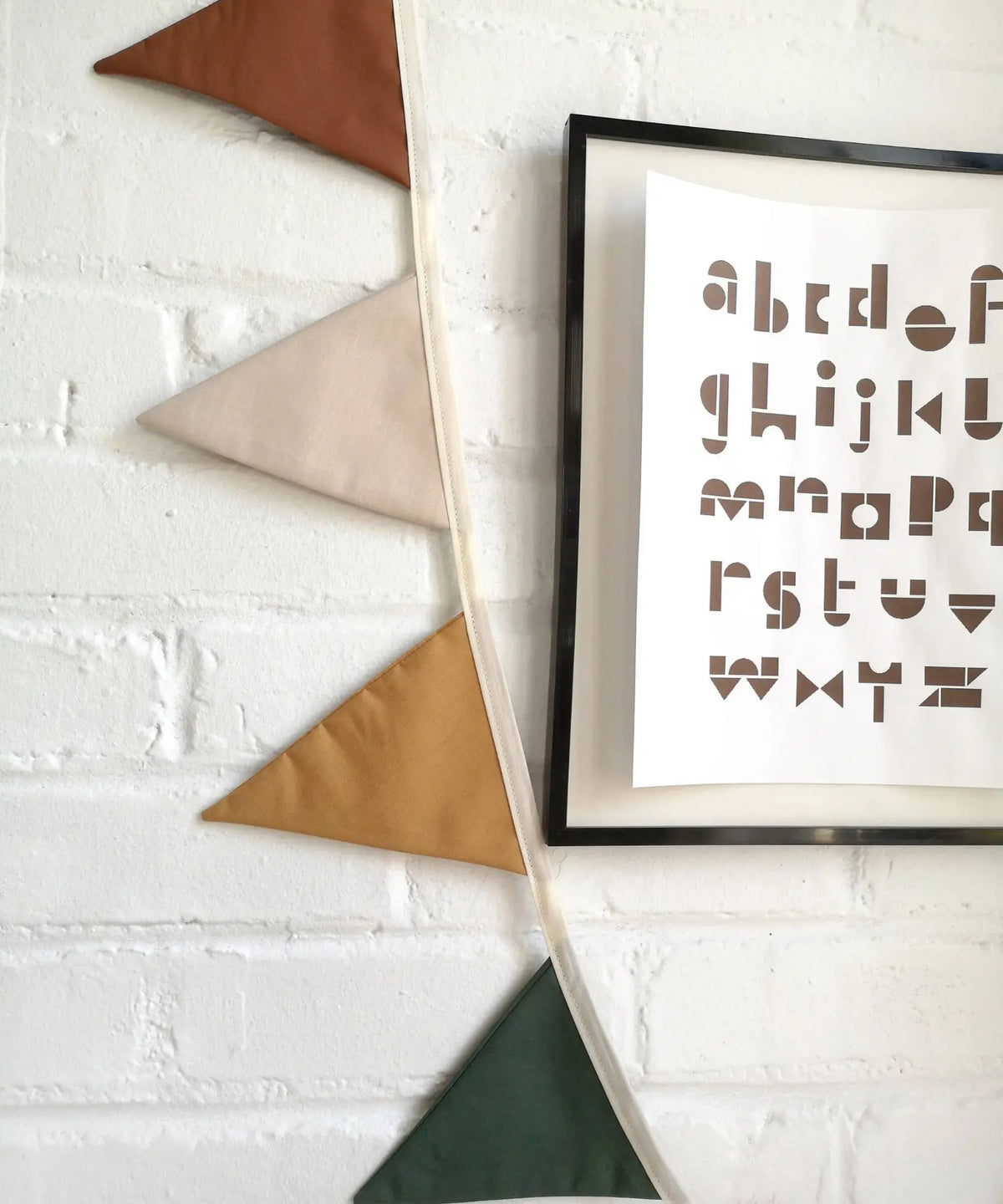 Woodland linen pennant garland in cinnamon, ivory, ochre and deep green close up detail