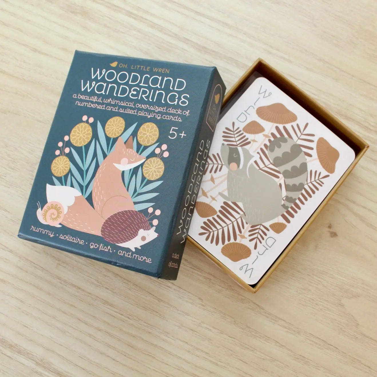 Woodland playing cards box open with fox illustration and cards inside