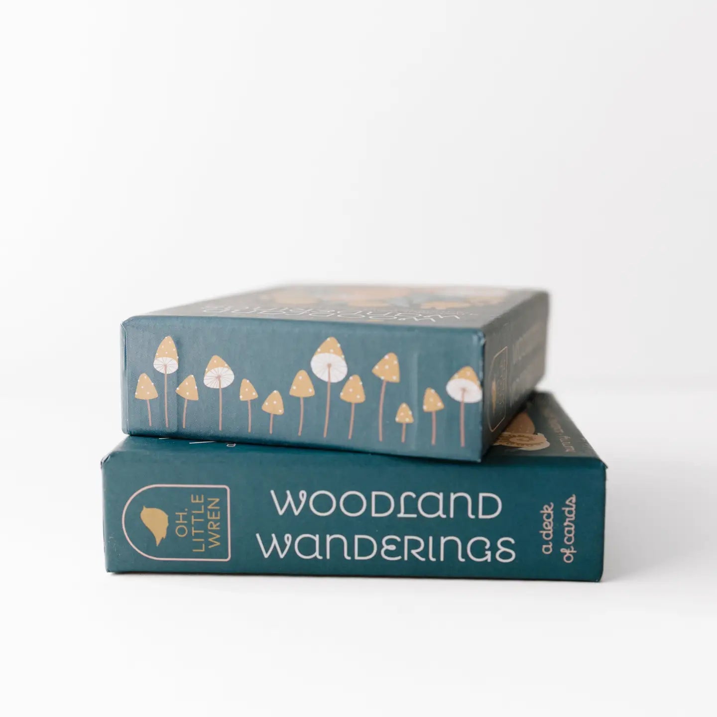 Two woodland playing cards deck boxes shown from side views