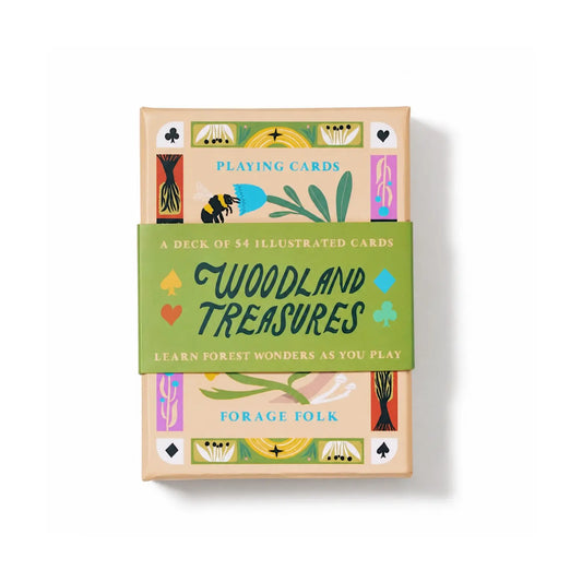 A deck of illustrated playing cards wrapped in a green paper band that reads 'Woodland Treasures'. 