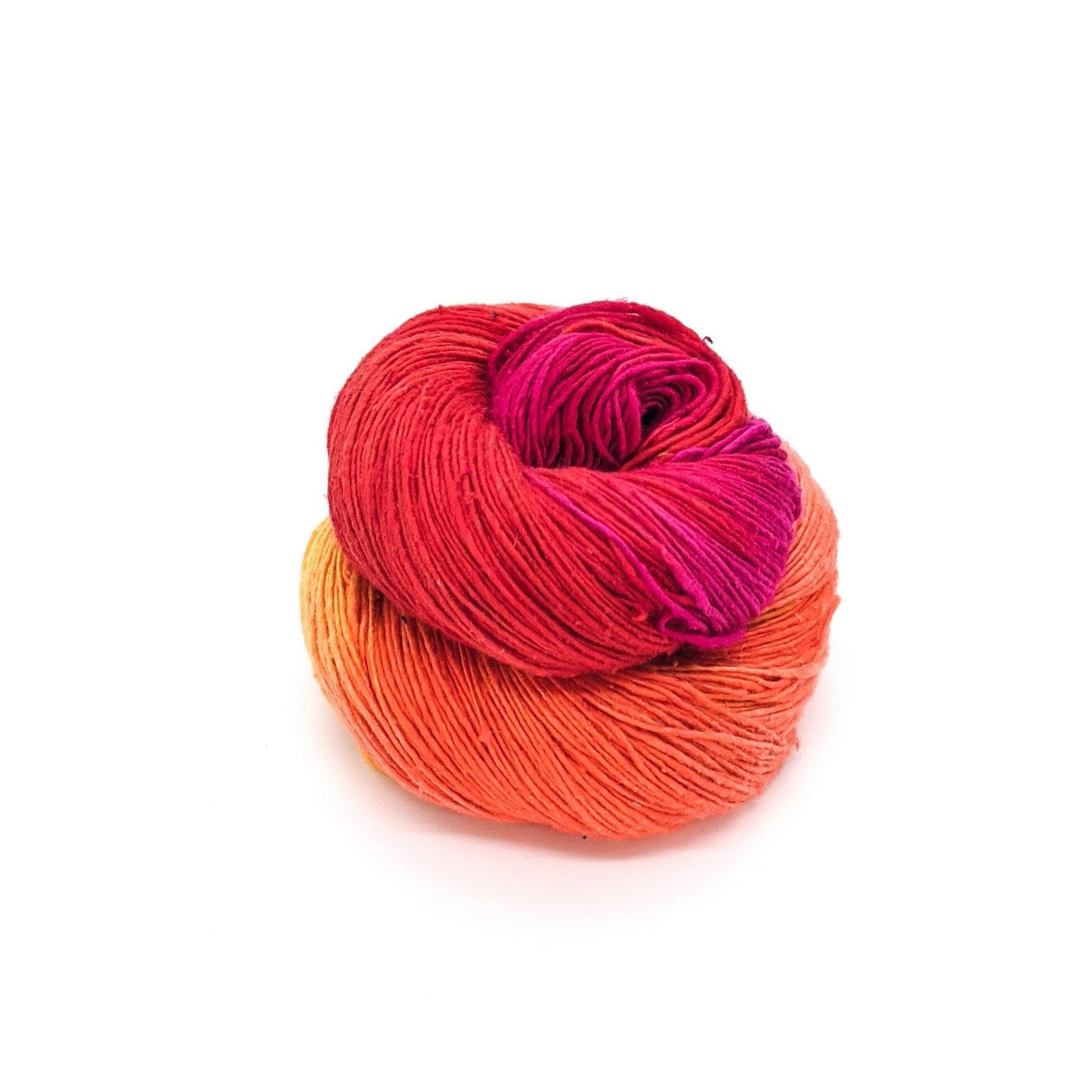 lace weight recycled silk yarn in red, orange, and golden yellow