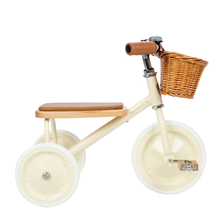 Banwood vintage trike toddler tricycle with basket in cream side view on white background
