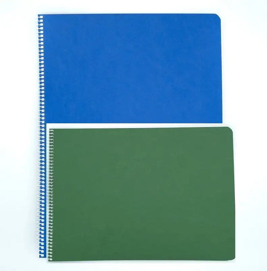 A green Book of Centuries on top of a Blue Book of Centuries, Spiral, on a white background