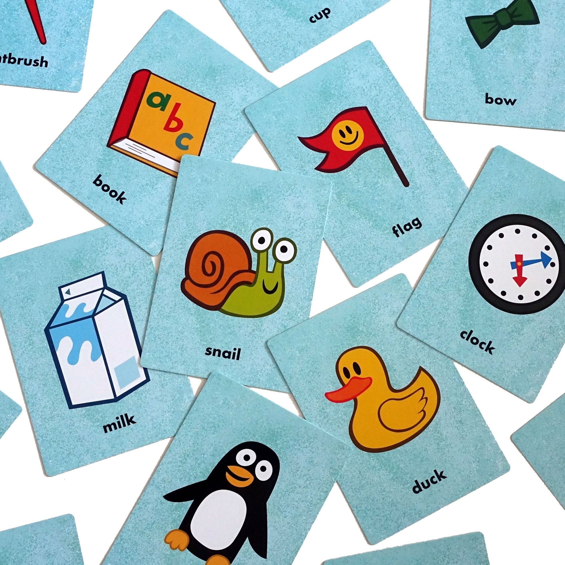 First Game:  Uh Oh! At Home cards spread out over a white background