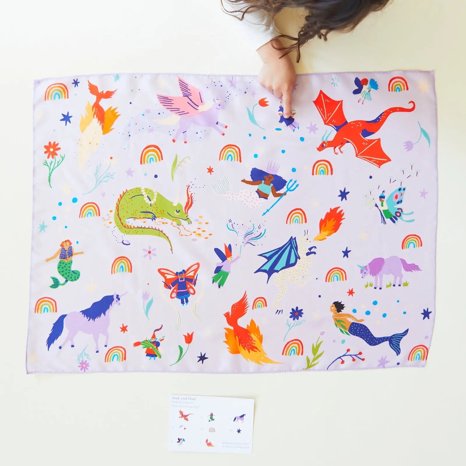 Girl playing with Magical Creatures Seek and Find Playsilk