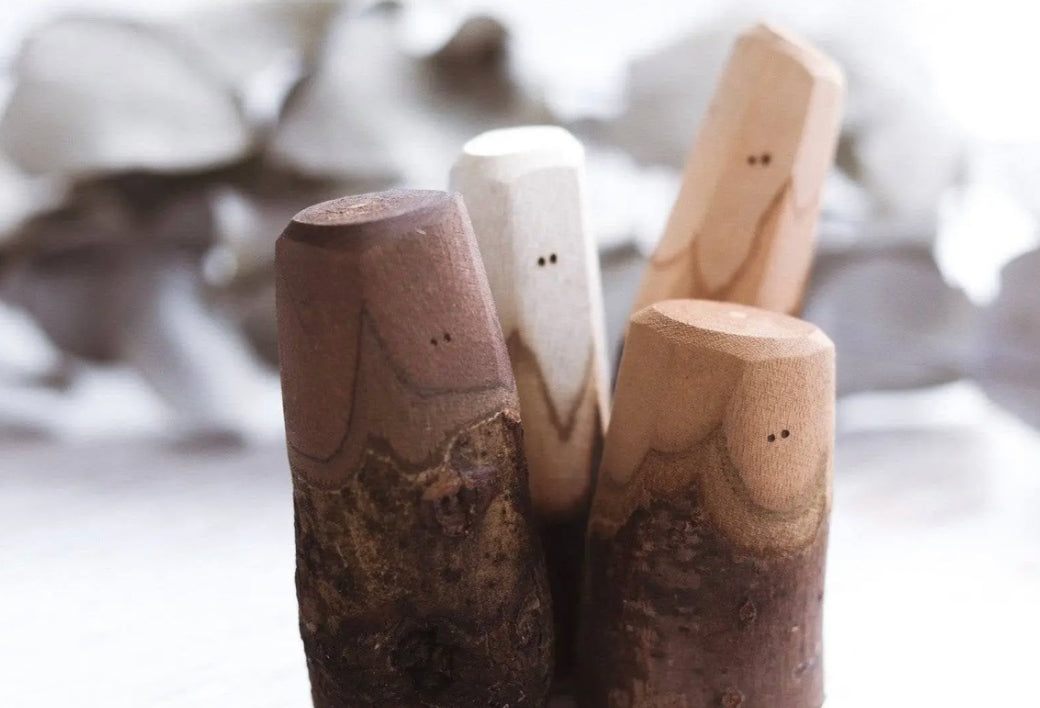 Close-up of mixed bark wooden Tree People figures for storytelling and pretend play