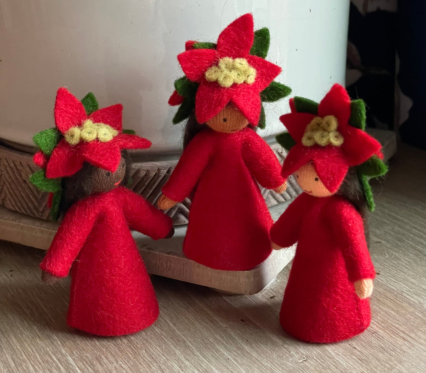 three Poinsettia Flower Fairy Dolls by Ambrosius in different skin tones