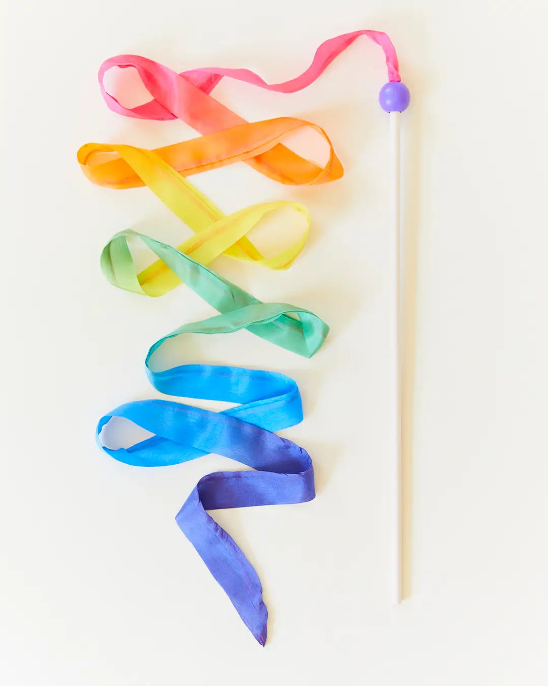 Sarah’s Silks Rainbow Silk Streamer Wand with multicolor mulberry silk ribbon and purple wooden bead.