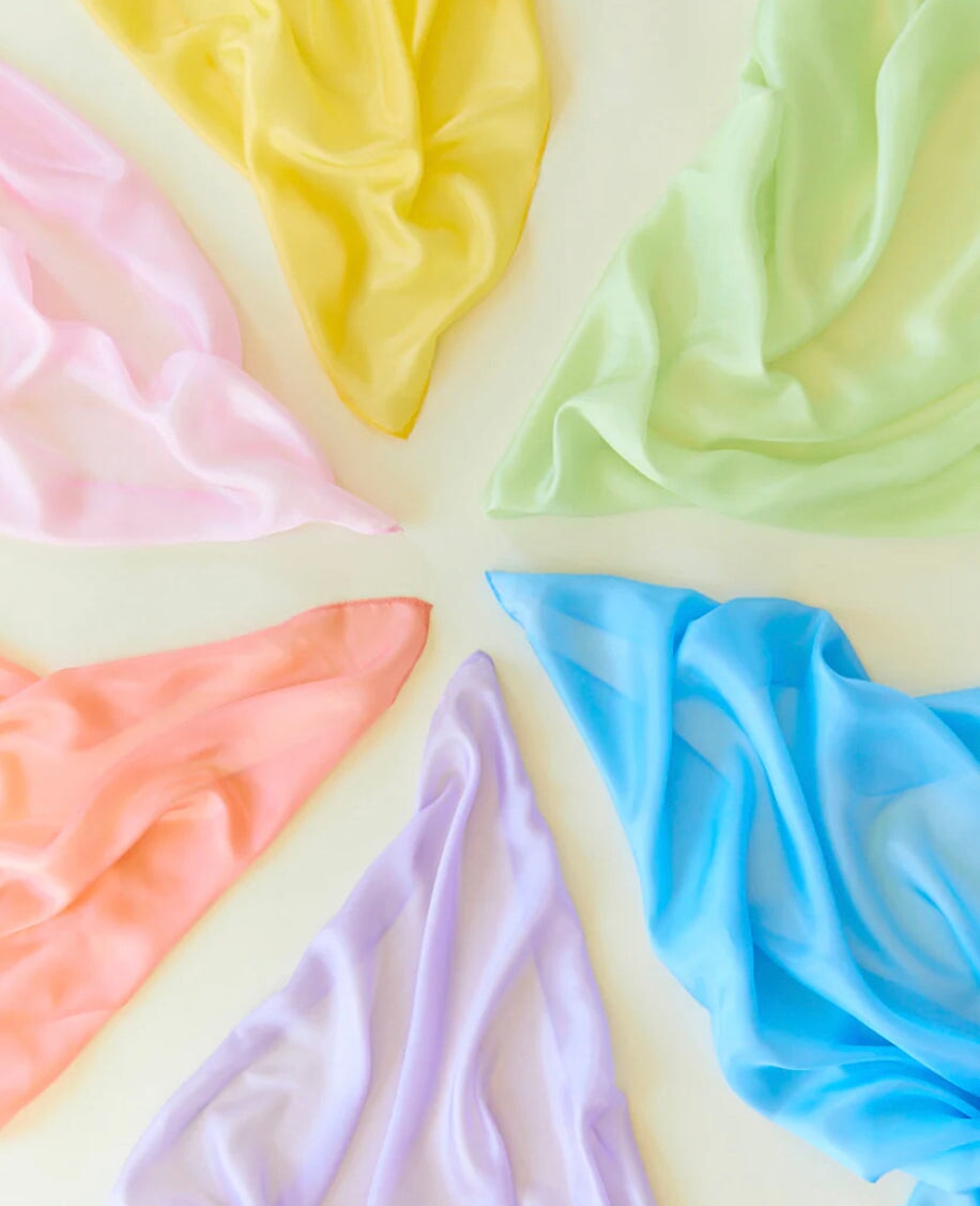 Sarah's Silks Pastel Solid Color Playsilks in Multiple Colors in a circle on a White Background