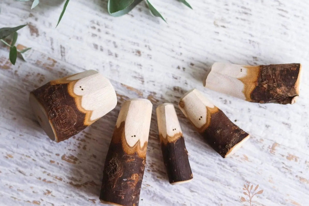 Hand-carved Tree People wooden figures with natural bark and wood grain details