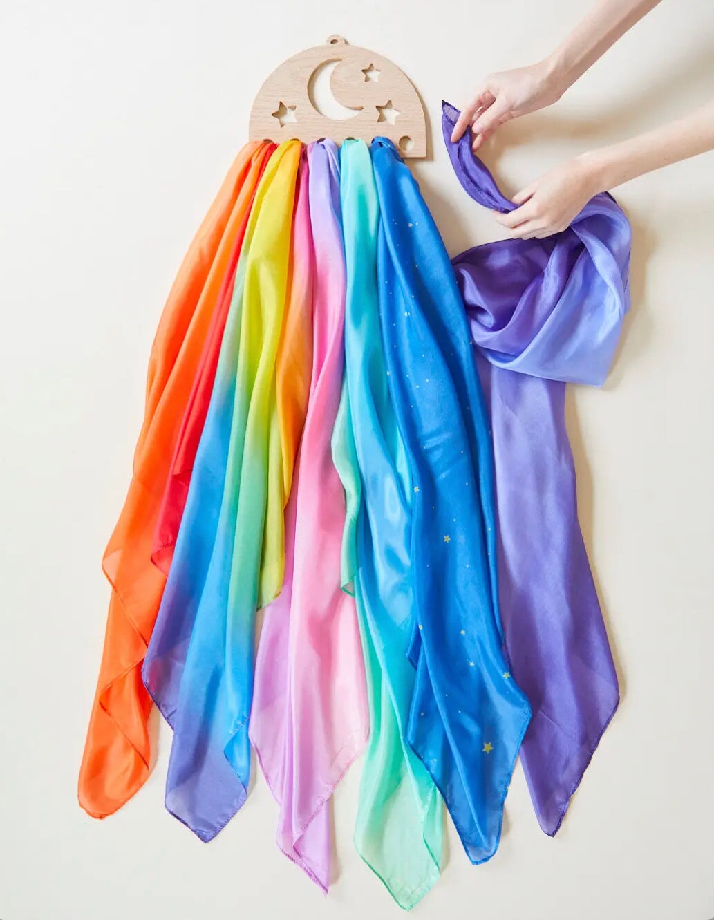 Sarah's Silks Wooden Playsilk Holder Moon and Stars with multi-colored scarves