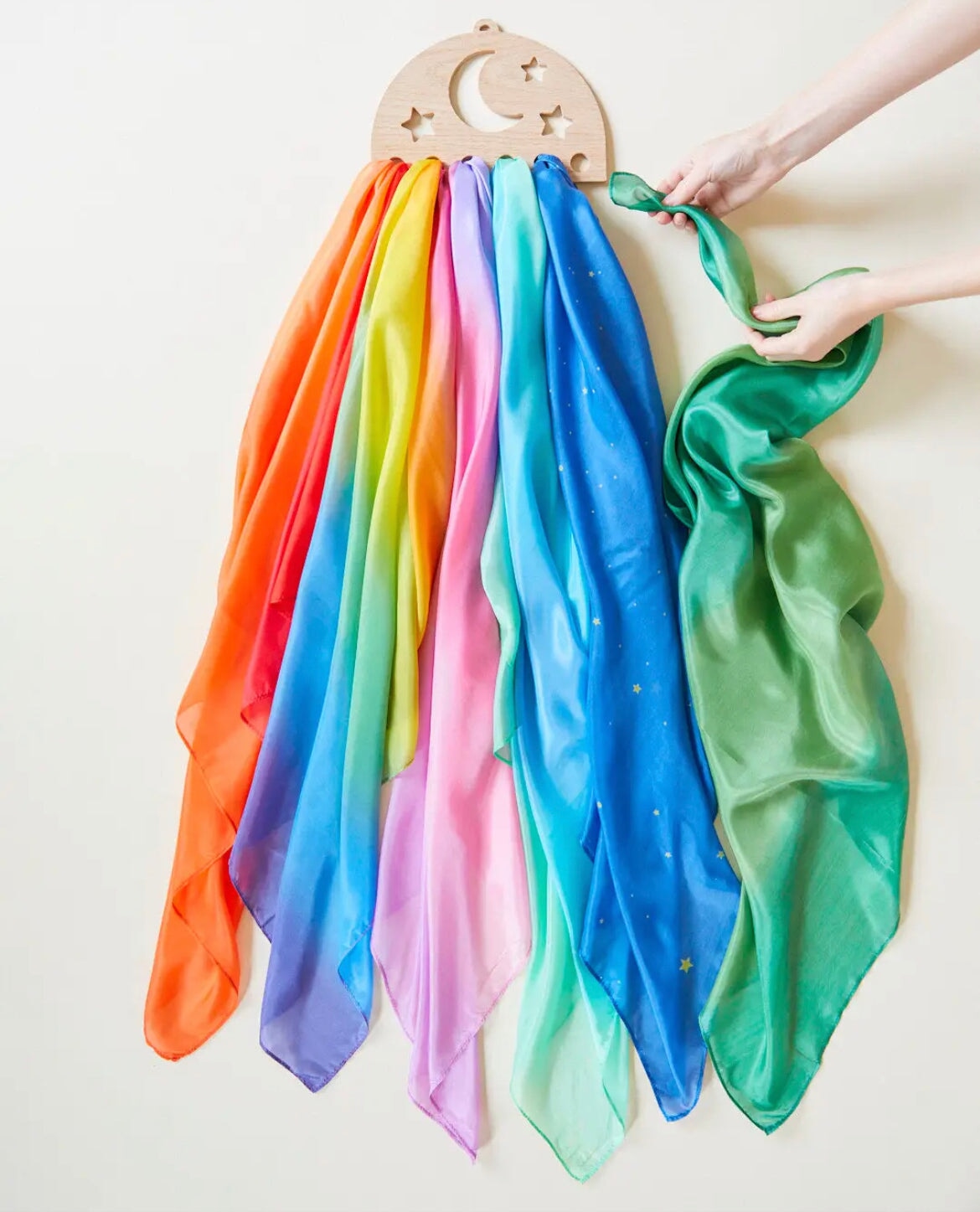 Sarah's Silks Wooden Playsilk Holder Moon and Stars with multi-colored scarves