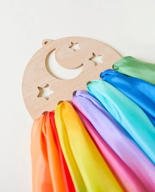 Sarah's Silks Wooden Playsilk Holder Moon and Stars with multi-colored scarves