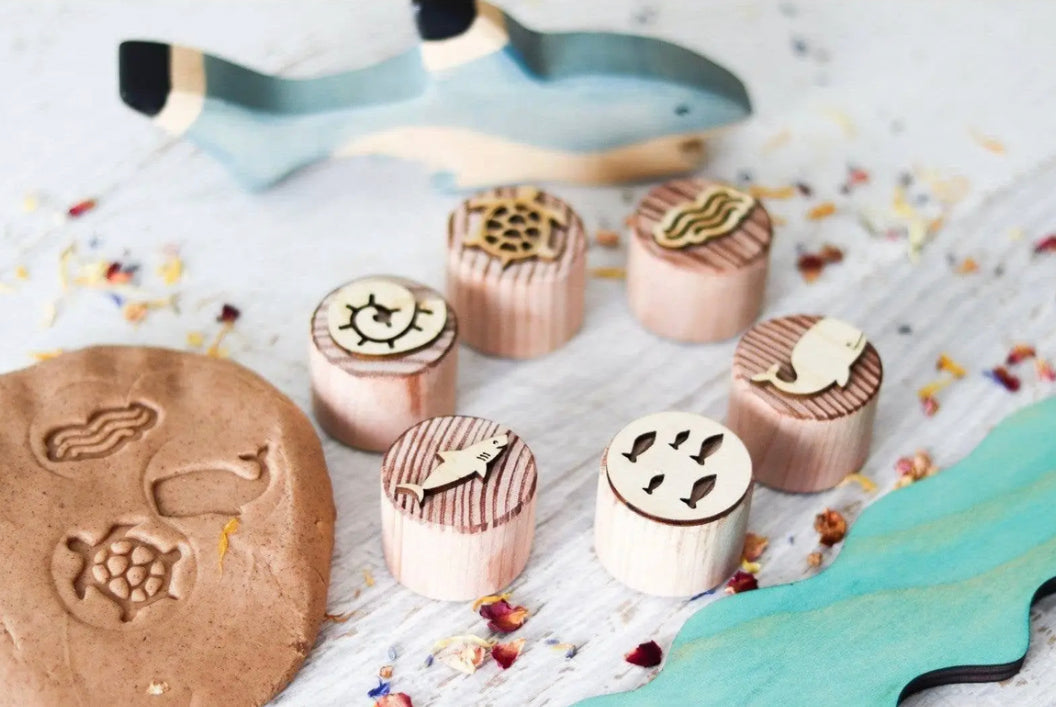 Close-up of ocean wooden stamps for pressing shapes into play dough, sand, or clay