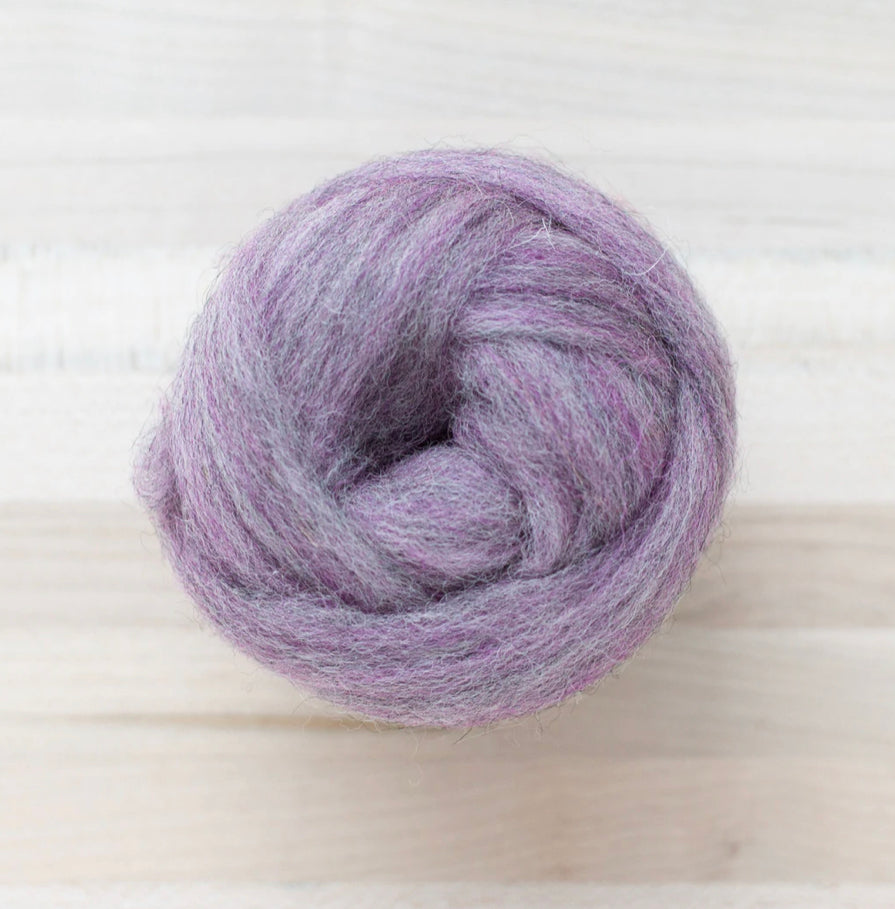 a knot of multi dimensional wool roving in wisteria purple and gray for needle felting